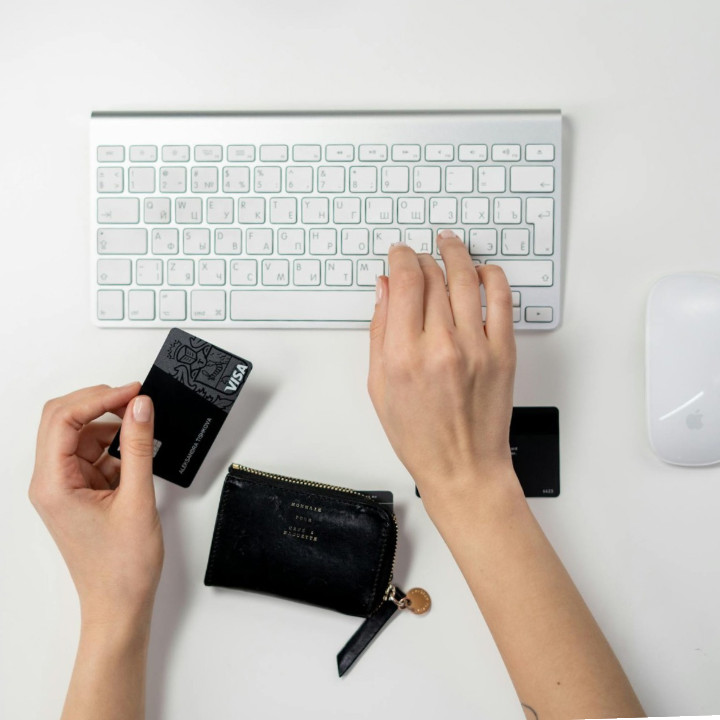 Online shopping checkout on keyboard with credit card
