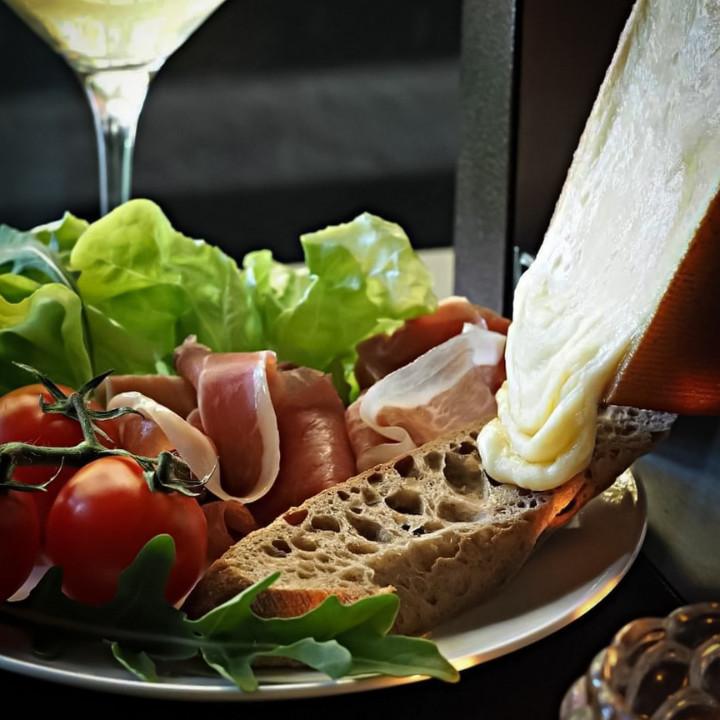 Charcuterie Board with Sourdough bread, lettuce, tomatoes, Parma ham and raclette cheese at Raymond Deli Club in Sai Kung guide