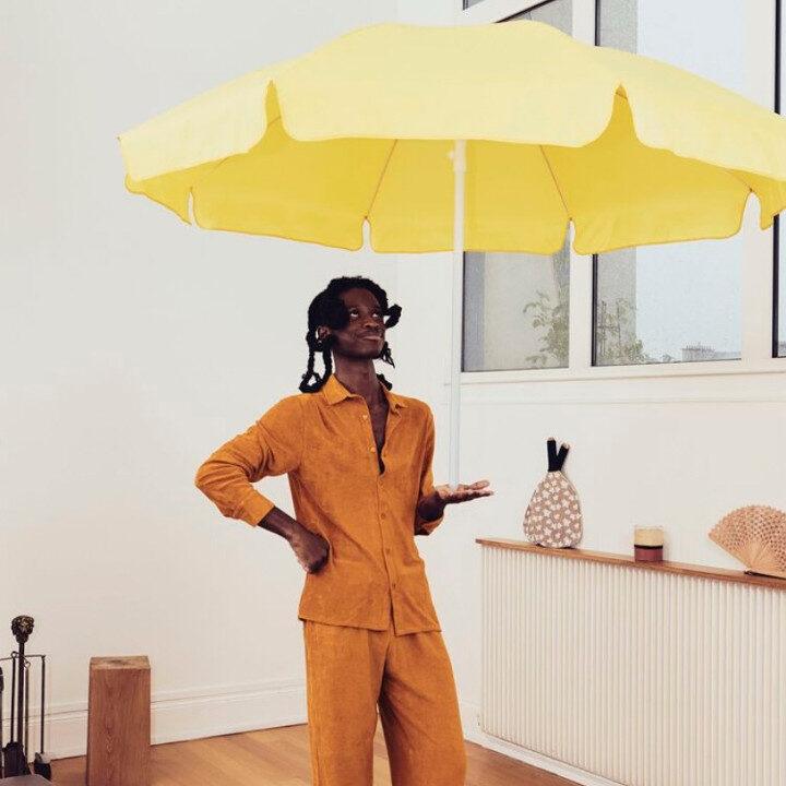 The White Lotus Resort Wear Edit with Vilebrequinโs latest collection featuring a mustard two-piece suit