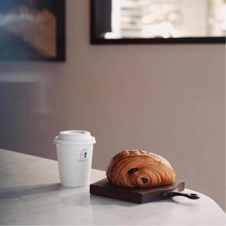 pain au chocolat with coffee at bakeshop parabolica